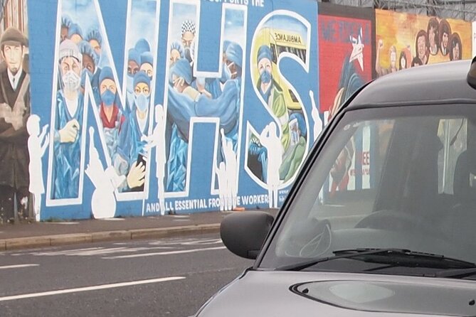 Black Taxi Mural "Tour Like A Local" - The Peace Wall in a ten-minute stop