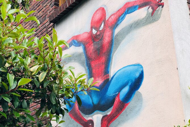 Eindhoven: Self guided Individual Street Art Tour - The final stretch: Monty Python, steam trains, and community hands