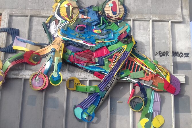 Street Art at Lisbon - Alfama adds old streets and newer walls