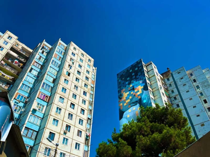 Tbilisi: Soviet Suburbs and Murals Exhibition Guided Tour - Green Parks Beside Gray Buildings