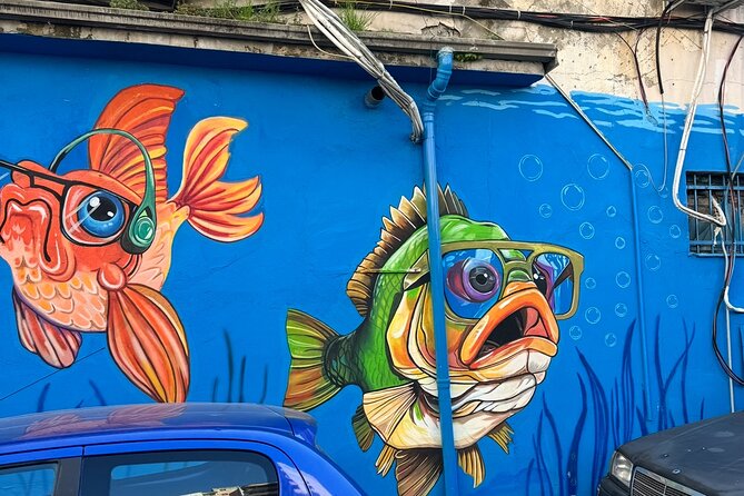 Tirana Mural Bike Tour: Street Art, Culture & Photography Stops - Myslym Shyri turns daily streets into an art gallery