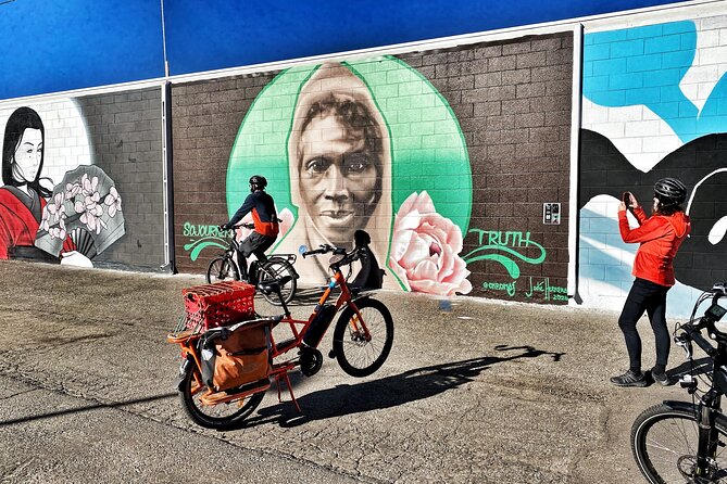 Wall to Wall Boulder eBike Mural Tour - The Boulder Theater alley and three festival murals